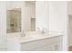 Elegant bathroom with double sink vanity, large mirror and stainless steel faucets at 16025 W Cottontail Ln, Surprise, AZ 85387