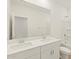 Bright bathroom featuring double vanity sinks, a mirror, and a shower/tub combo at 16025 W Cottontail Ln, Surprise, AZ 85387