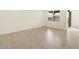 Bedroom features tile flooring, a window, and a doorway to another room at 16025 W Cottontail Ln, Surprise, AZ 85387