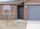 Charming single Gathering home with a low maintenance yard and gray accents at 16025 W Cottontail Ln, Surprise, AZ 85387