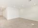 Spacious room with tile flooring and recessed lighting at 16025 W Cottontail Ln, Surprise, AZ 85387
