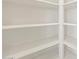 Large walk-in pantry with ample storage space and white shelving at 16025 W Cottontail Ln, Surprise, AZ 85387