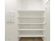 Walk-in pantry features solid shelving and plenty of room for storage at 16025 W Cottontail Ln, Surprise, AZ 85387