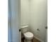 Convenient powder room with toilet and pedestal sink at 32137 N Saddlehorn Dr, San Tan Valley, AZ 85140