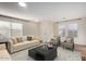 Bright living room with comfy seating and large windows at 8143 E Obispo Ave, Mesa, AZ 85212