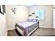Cozy bedroom with a purple-themed decor, including a bed, bedding, and coordinated accents at 901 W Witt Ave, Queen Creek, AZ 85140