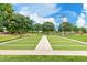 Well-maintained bocce ball court surrounded by mature trees and green spaces, promoting outdoor activities at 901 W Witt Ave, Queen Creek, AZ 85140