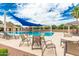 Relaxing community pool area with ample seating and shade, creating a perfect oasis for residents at 901 W Witt Ave, Queen Creek, AZ 85140