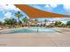 Spacious community pool with water features and shaded areas, offering a delightful recreational experience at 901 W Witt Ave, Queen Creek, AZ 85140
