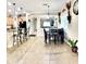 Open dining area featuring tile flooring, a black dining set, and views to the kitchen and living area at 901 W Witt Ave, Queen Creek, AZ 85140