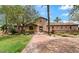 Impressive home exterior featuring lush landscaping, a stone facade, and a grand entrance way at 901 W Witt Ave, Queen Creek, AZ 85140