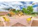 Colorful community playground with various play structures and shaded seating areas, creating a fun and safe environment at 901 W Witt Ave, Queen Creek, AZ 85140