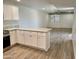 Open-concept kitchen featuring tile floors, ample storage space, and speckled countertops at 27250 N 64Th St # 1, Scottsdale, AZ 85266