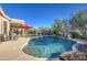 Inviting pool featuring a rock waterfall, cool deck, and a refreshing ambiance for outdoor relaxation at 3248 N Boulder Cyn, Mesa, AZ 85207