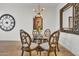 Modern dining room with round glass table and four ornate chairs at 5151 N 13Th Pl # 4, Phoenix, AZ 85014