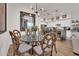 Elegant dining room with glass-top table, ornate chairs, and a large mirror at 5151 N 13Th Pl # 4, Phoenix, AZ 85014