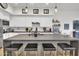 Modern kitchen with large island, white cabinets, and gray countertops at 5151 N 13Th Pl # 4, Phoenix, AZ 85014