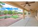 Relaxing covered patio with beautiful landscaping at 13668 W Figueroa Dr, Sun City West, AZ 85375