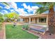 Well maintained backyard with lovely landscaping and a covered patio at 13668 W Figueroa Dr, Sun City West, AZ 85375