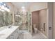 Well-lit bathroom showcases a sleek glass shower and a pristine toilet for convenience at 13668 W Figueroa Dr, Sun City West, AZ 85375