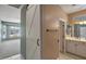 Bathroom vanity features dual sinks, white cabinets, and brushed bronze fixtures at 13668 W Figueroa Dr, Sun City West, AZ 85375