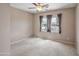 Cozy bedroom with neutral walls and carpet, enhanced by natural light from large windows at 13668 W Figueroa Dr, Sun City West, AZ 85375