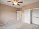 Neutral bedroom with a ceiling fan, closet, and carpeted floors at 13668 W Figueroa Dr, Sun City West, AZ 85375