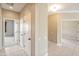 Hallway with tile flooring leading to bedrooms, offering ample living space at 13668 W Figueroa Dr, Sun City West, AZ 85375