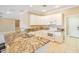 Bright kitchen with white cabinets, granite countertops, and stainless steel appliances at 13668 W Figueroa Dr, Sun City West, AZ 85375