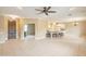 Open-concept living space with tile flooring and direct access to the kitchen at 13668 W Figueroa Dr, Sun City West, AZ 85375