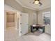 Corner office space with two windows providing bright, natural light and tile floors at 13668 W Figueroa Dr, Sun City West, AZ 85375