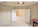 Home office with tile floor, ceiling fan, and bright, natural light at 13668 W Figueroa Dr, Sun City West, AZ 85375