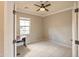Office space with ceiling fan, tile floor, and bright natural light at 13668 W Figueroa Dr, Sun City West, AZ 85375