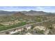 Aerial view of community and golf course nestled in the desert, and front row seats to mountain views at 6159 S Avenida Del Sol --, Gold Canyon, AZ 85118