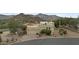 Single-story desert home with a two car garage with mature landscaping and mountain views at 6159 S Avenida Del Sol --, Gold Canyon, AZ 85118