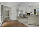 Spacious living room with fireplace, tiled entry and view of the bathroom at 6159 S Avenida Del Sol --, Gold Canyon, AZ 85118