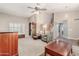 Open living space with high ceilings, shutters, and a staircase at 7752 W Mary Jane Ln, Peoria, AZ 85382