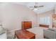 Spacious living room with vaulted ceiling, ceiling fan, and large window with shutters at 7752 W Mary Jane Ln, Peoria, AZ 85382