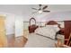 Main bedroom featuring vaulted ceiling, fan, and ensuite access at 7752 W Mary Jane Ln, Peoria, AZ 85382