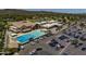 Community clubhouse with a large pool and ample parking at 14235 N Piping Rock Ct, Phoenix, AZ 85023