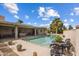 Expansive pool area with patio furniture, providing ample space for relaxation and entertaining at 14235 N Piping Rock Ct, Phoenix, AZ 85023