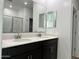 Double vanity bathroom with modern fixtures and large mirror at 5607 W Summerside Rd, Laveen, AZ 85339