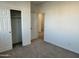 Bedroom with double door closet and access to another room at 5607 W Summerside Rd, Laveen, AZ 85339