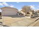 Exterior view of a house with a driveway and a small front yard at 8660 N 114Th Ave, Peoria, AZ 85345