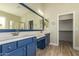 Bathroom featuring double sink vanity, framed mirror, and a separate room for the toilet and shower at 2156 E Aloe Pl, Chandler, AZ 85286