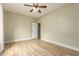 This bedroom features wood-look flooring and neutral colored walls at 2156 E Aloe Pl, Chandler, AZ 85286