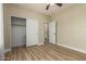 This bedroom features wood-look flooring and a closet with sliding doors at 2156 E Aloe Pl, Chandler, AZ 85286