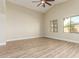 Serene bedroom featuring hardwood floors, large windows, and neutral decor for a relaxing atmosphere at 2156 E Aloe Pl, Chandler, AZ 85286