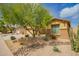 Well-kept home with desert landscaping, a mature tree, and a charming facade in a friendly neighborhood at 2156 E Aloe Pl, Chandler, AZ 85286