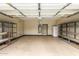Spacious garage with shelving units, water heater, and additional refrigerator at 2156 E Aloe Pl, Chandler, AZ 85286